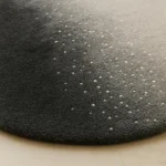 Close-up view of Ombre Starfield hand tufted rug showing textured pile and subtle celestial speckled detail.